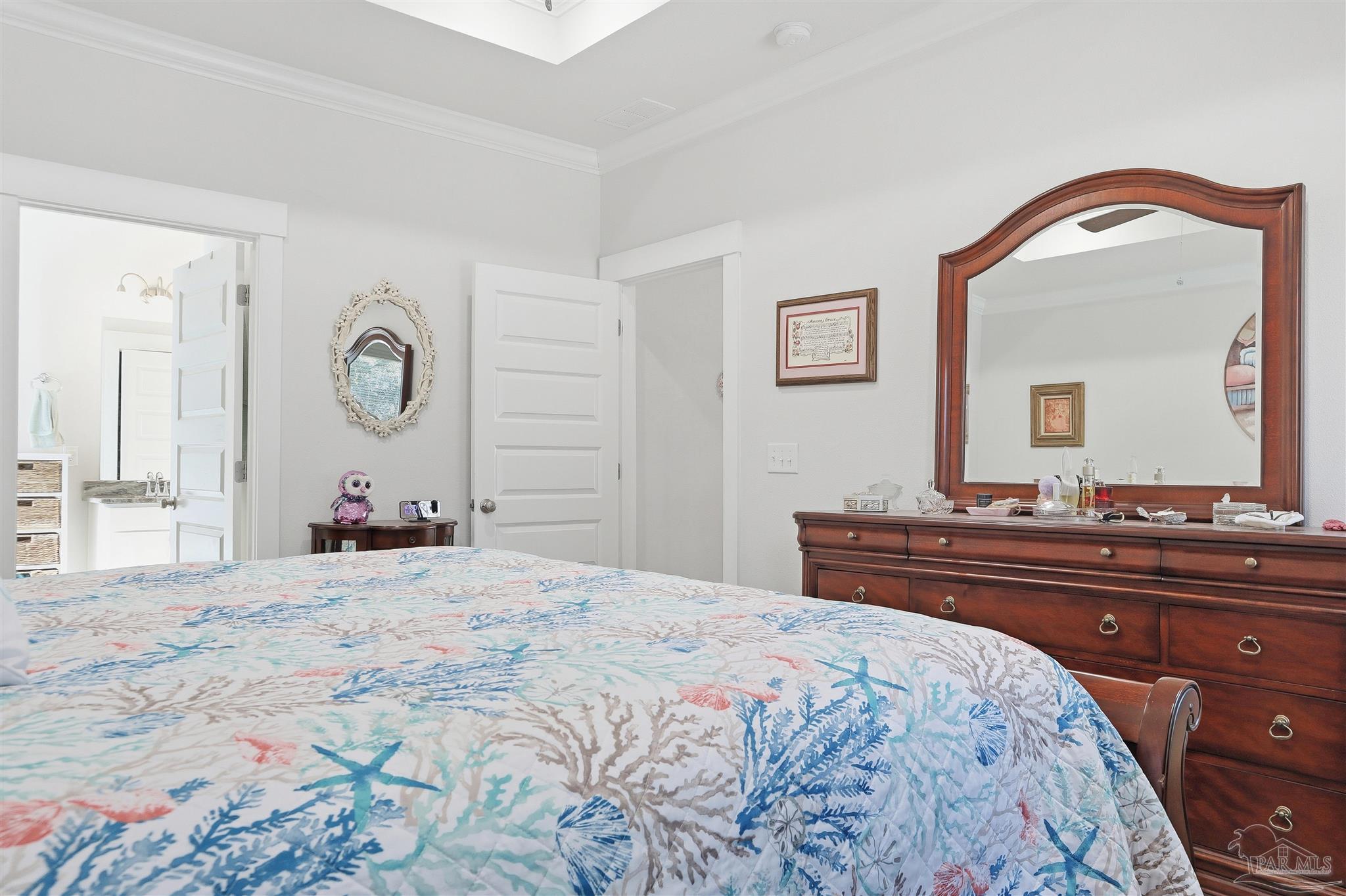 1932 Appleton Drive Cantonment, FL 32533 - Photo 28 of 57 a bedroom with a bed and a dresser