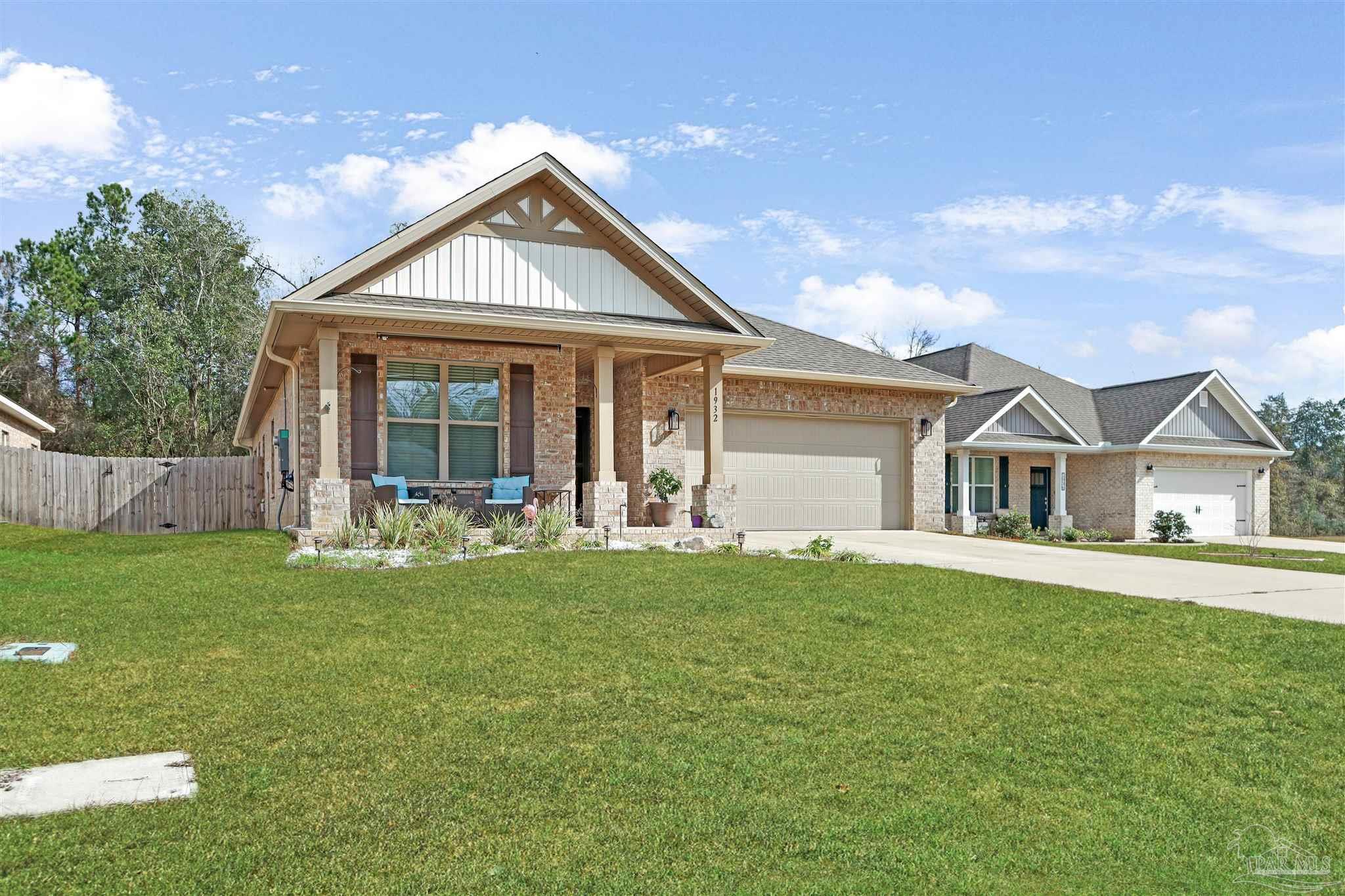 1932 Appleton Drive Cantonment, FL 32533 - Photo 3 of 57 a front view of a house with a yard and porch