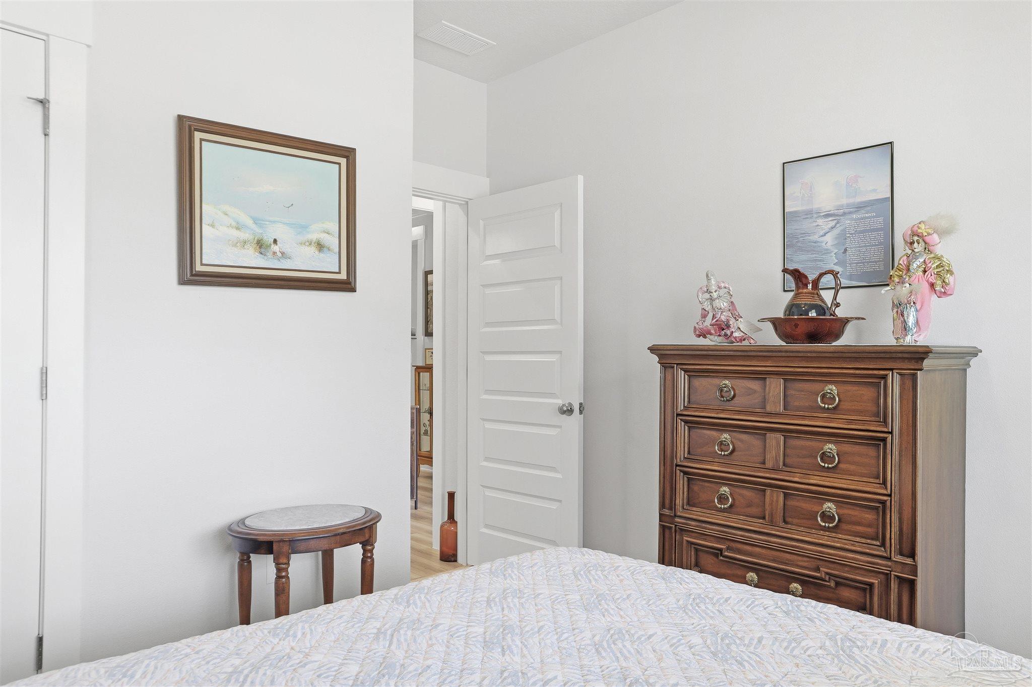 1932 Appleton Drive Cantonment, FL 32533 - Photo 33 of 57 a bedroom with a bed and a dresser in it