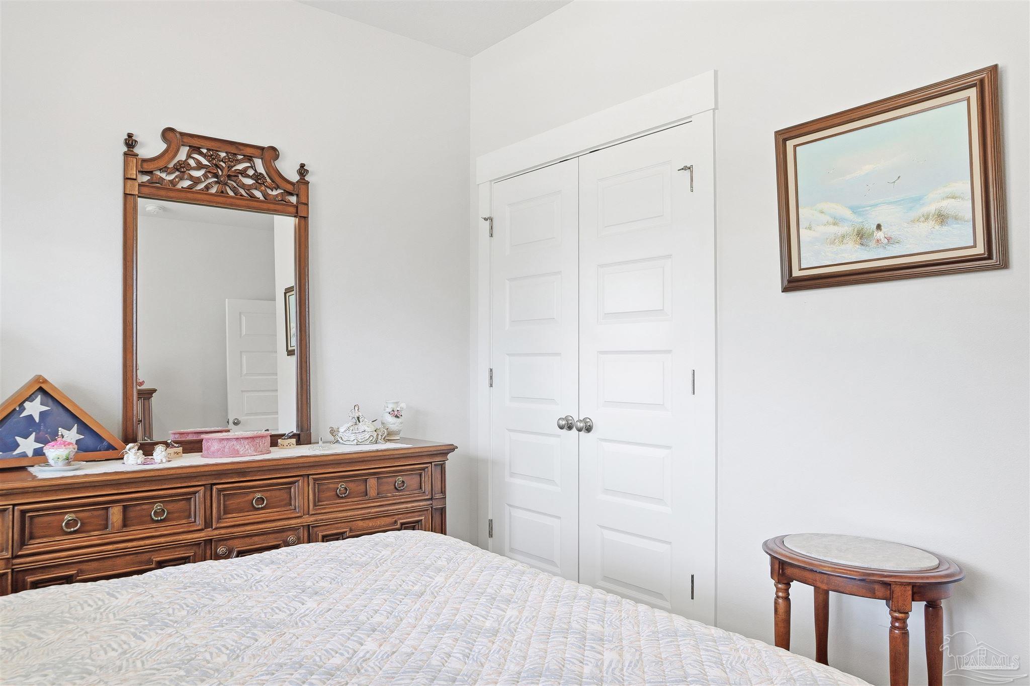 1932 Appleton Drive Cantonment, FL 32533 - Photo 34 of 57 a bedroom with a bed and a dresser