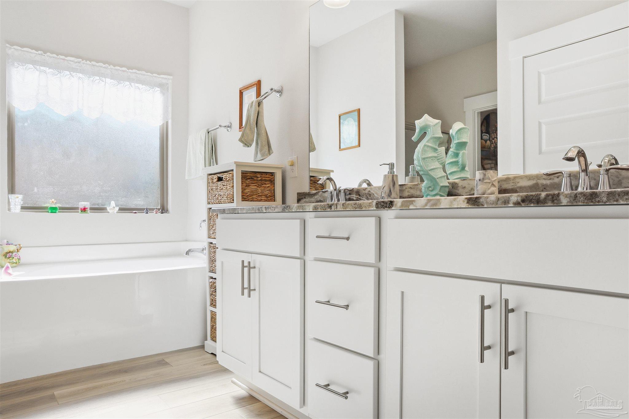 1932 Appleton Drive Cantonment, FL 32533 - Photo 45 of 57 a bathroom with a sink and a mirror