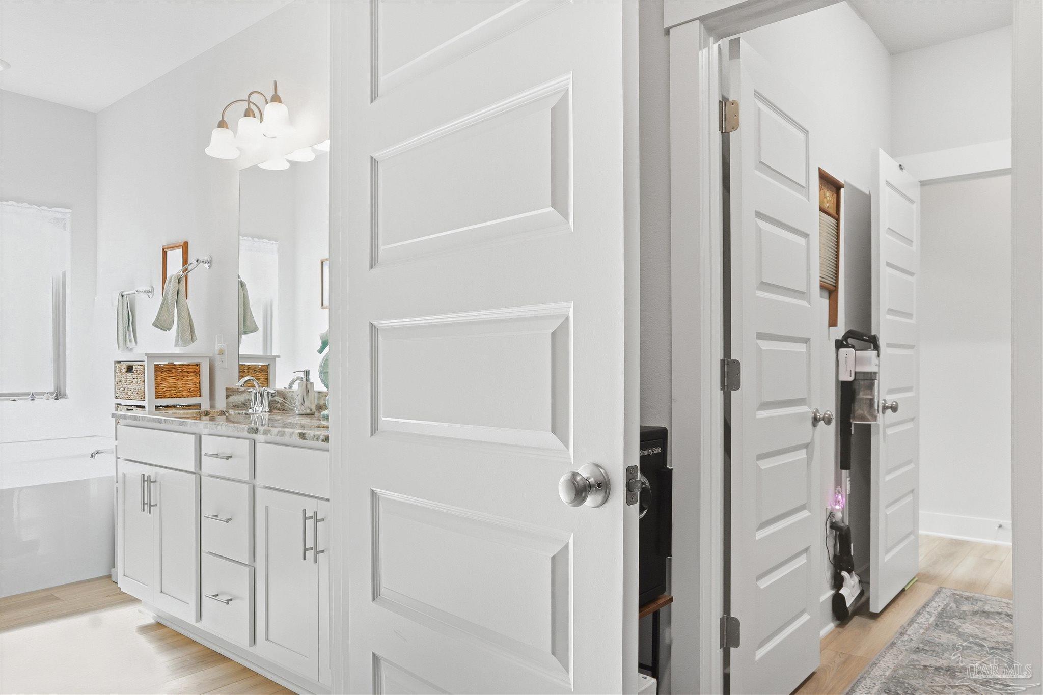 1932 Appleton Drive Cantonment, FL 32533 - Photo 46 of 57 a bathroom with a sink vanity and a mirror