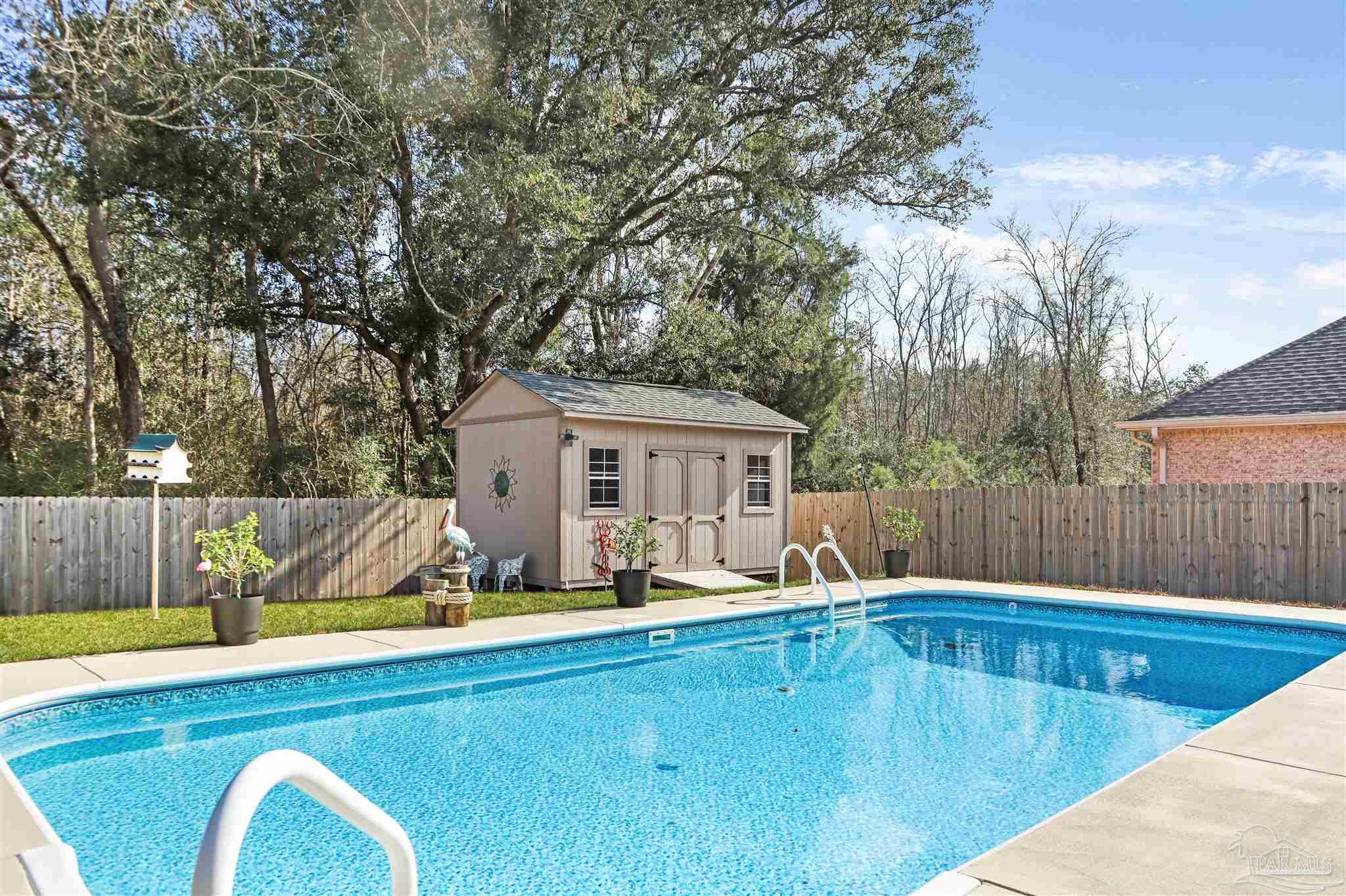 1932 Appleton Drive Cantonment, FL 32533 - Photo 51 of 57 a view of a house with swimming pool