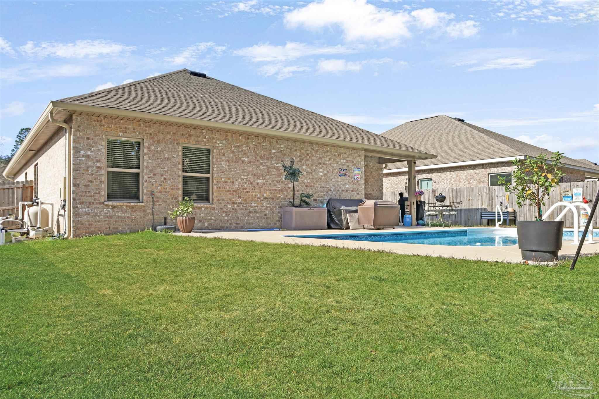 1932 Appleton Drive Cantonment, FL 32533 - Photo 54 of 57 a front view of a house with garden