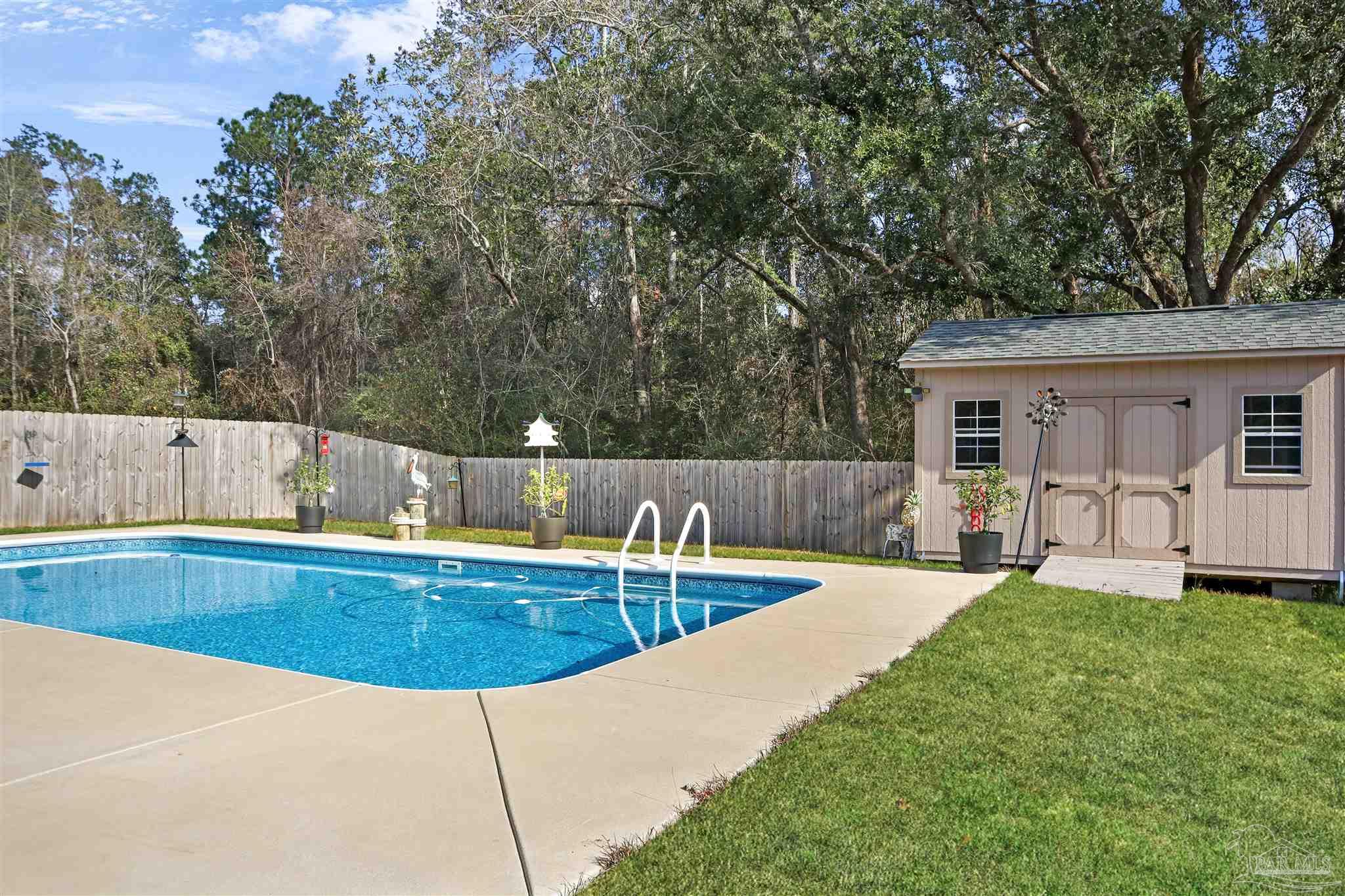 1932 Appleton Drive Cantonment, FL 32533 - Photo 56 of 57 a view of a house with swimming pool