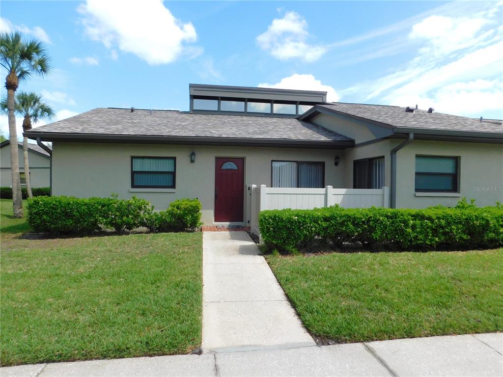 40 Dale Place Oldsmar, FL 34677 - Photo 1 of 32 a front view of a house with a yard