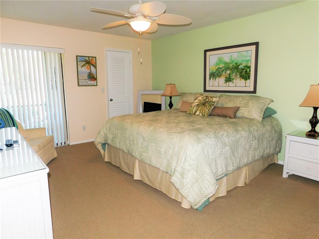 40 Dale Place Oldsmar, FL 34677 - Photo 13 of 32 a spacious bedroom with a bed and a chandelier