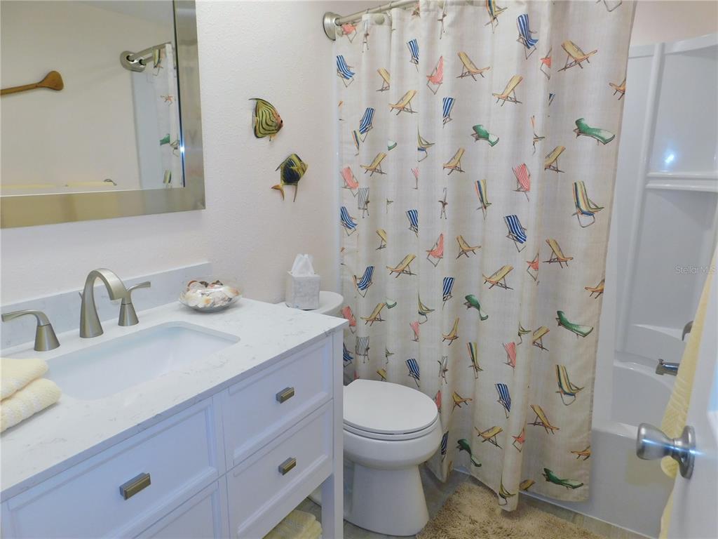 40 Dale Place Oldsmar, FL 34677 - Photo 18 of 32 a bathroom with a granite countertop sink and a toilet