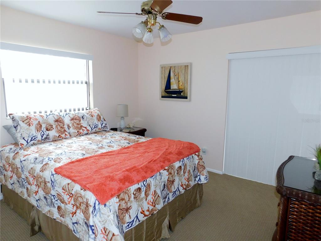 40 Dale Place Oldsmar, FL 34677 - Photo 19 of 32 a bedroom with a bed and a chandelier