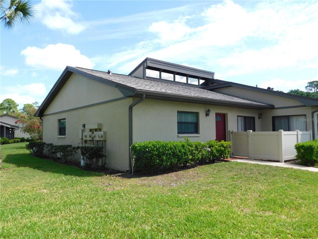 40 Dale Place Oldsmar, FL 34677 - Photo 2 of 32 a front view of a house with garden