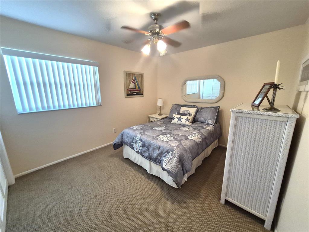 40 Dale Place Oldsmar, FL 34677 - Photo 21 of 32 a bedroom with a bed and a window