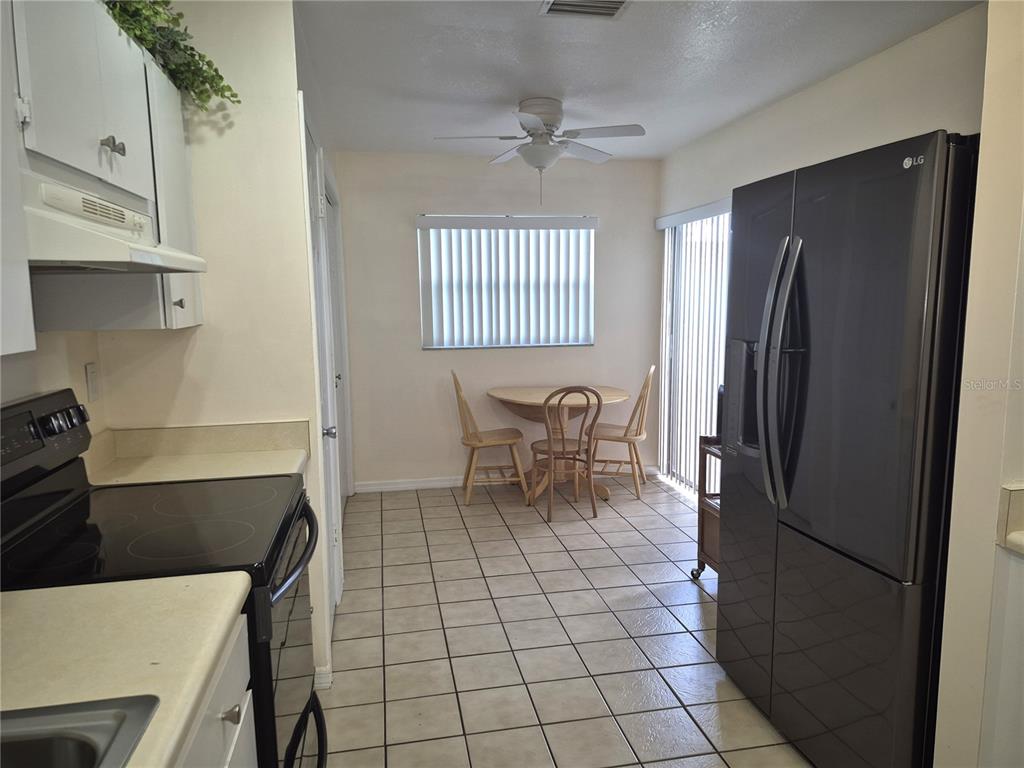 40 Dale Place Oldsmar, FL 34677 - Photo 22 of 32 a kitchen with a refrigerator and a sink