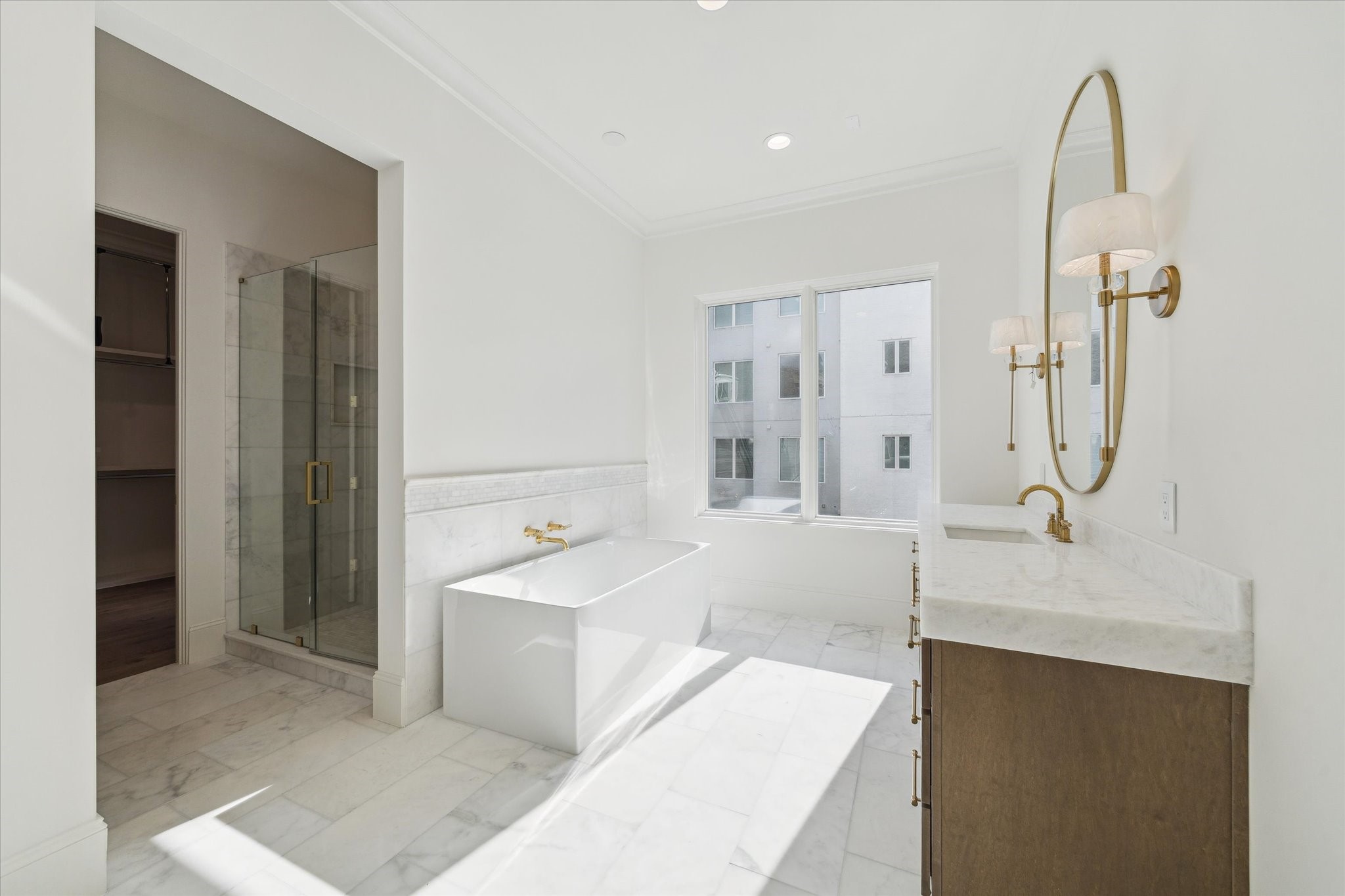 25 Wentworth Gate Path Houston, TX 77027 - Photo 16 of 32 Custom Benedettini cabinetry, Bianco Superiore Quartzite countertops, Kallista Perfect under-mount centric
rectangle sinks with Kallista One fixtures, weathered brass sconces complete this elegant and serene primary retreat.