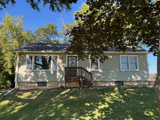 43220 Deep Lake Road Antioch, IL 60002 - Photo 1 of 1 a backyard of a house with table and chairs