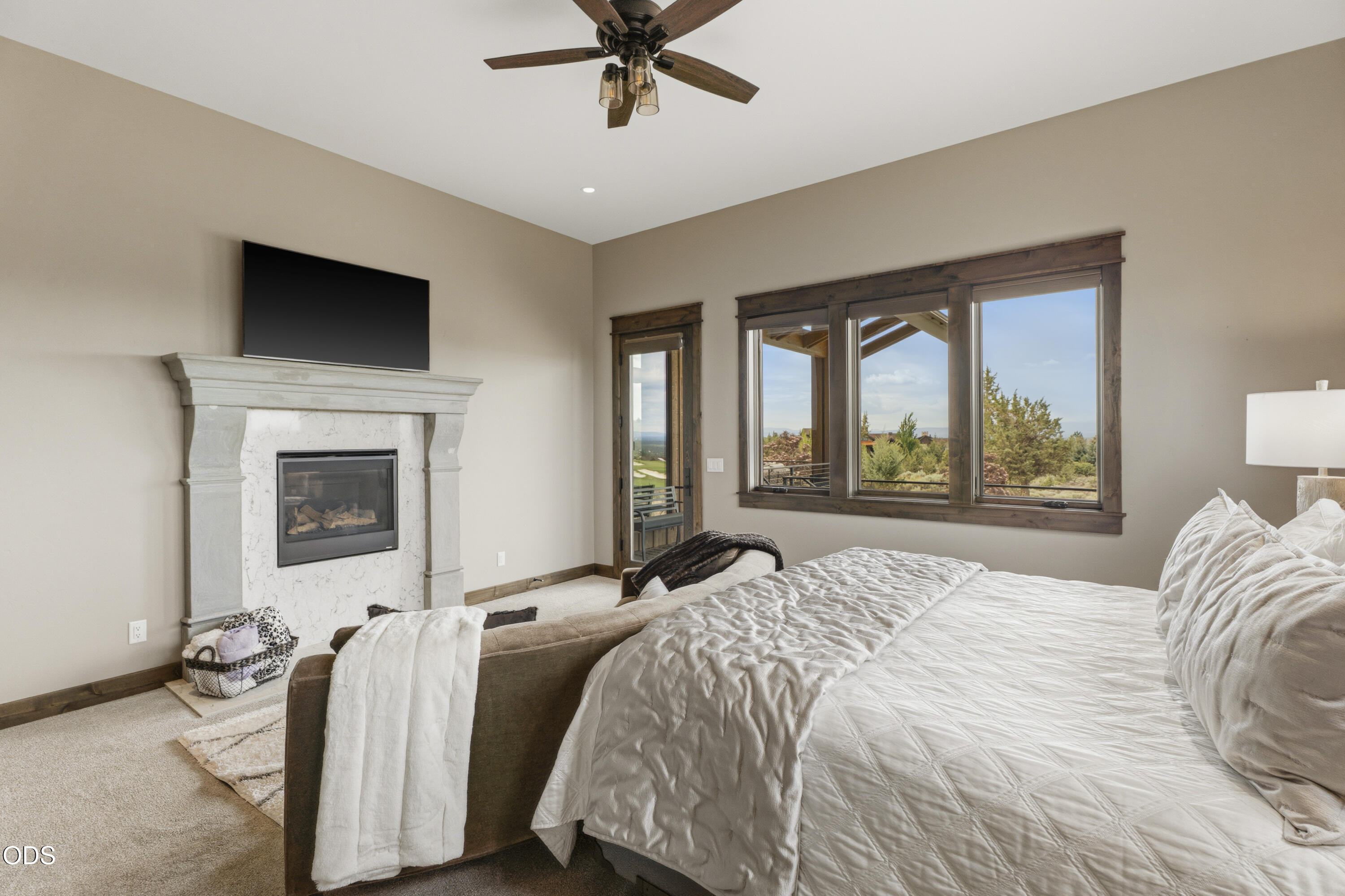 15935 South W Brasada Ranch Road Powell Butte, OR 97753 - Photo 18 of 45 a bedroom with a bed and a flat screen tv