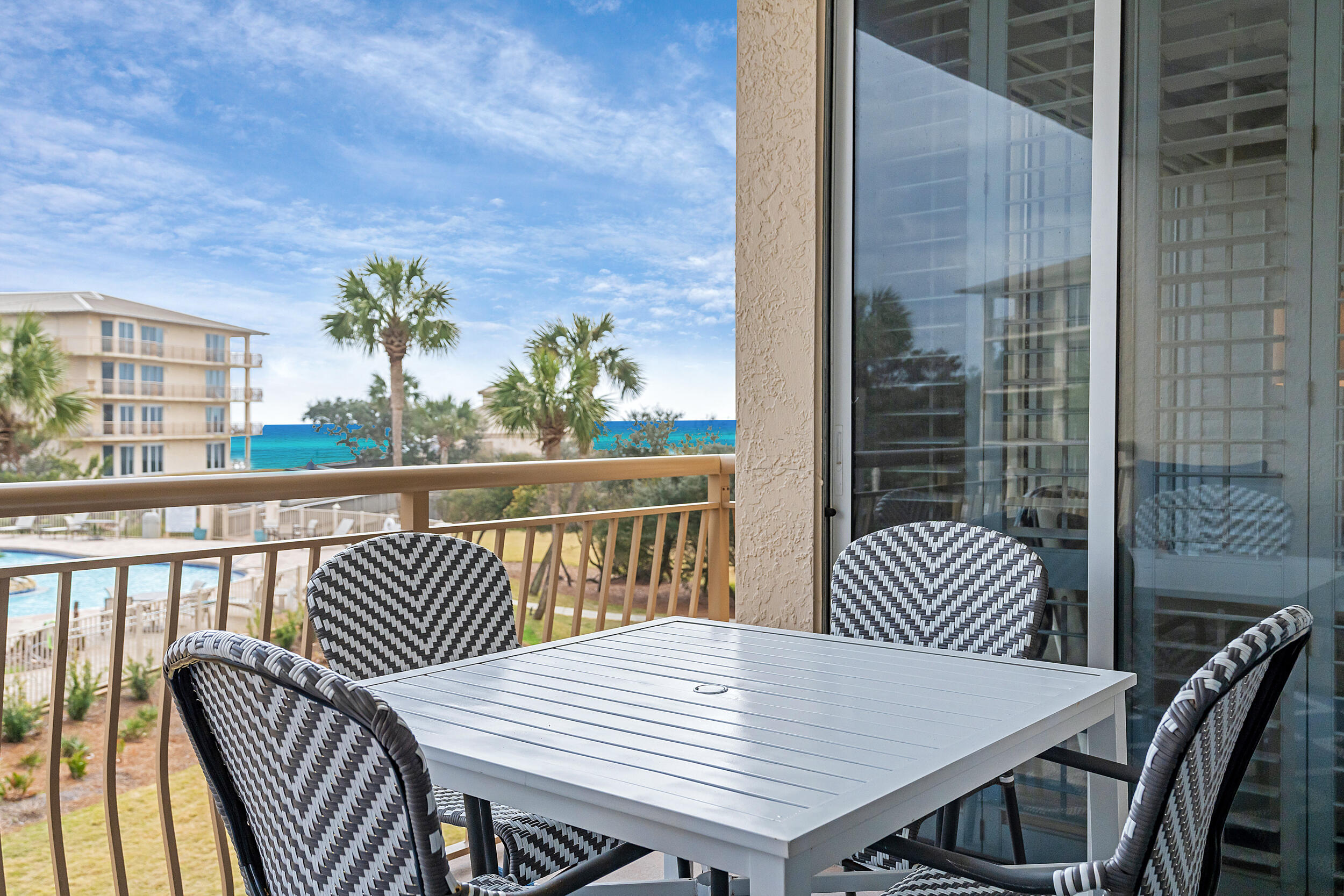 10254 East Co Highway, Unit 233 Inlet Beach, FL 32461 - Photo 18 of 46 a view of a dining room with furniture window and wooden floor