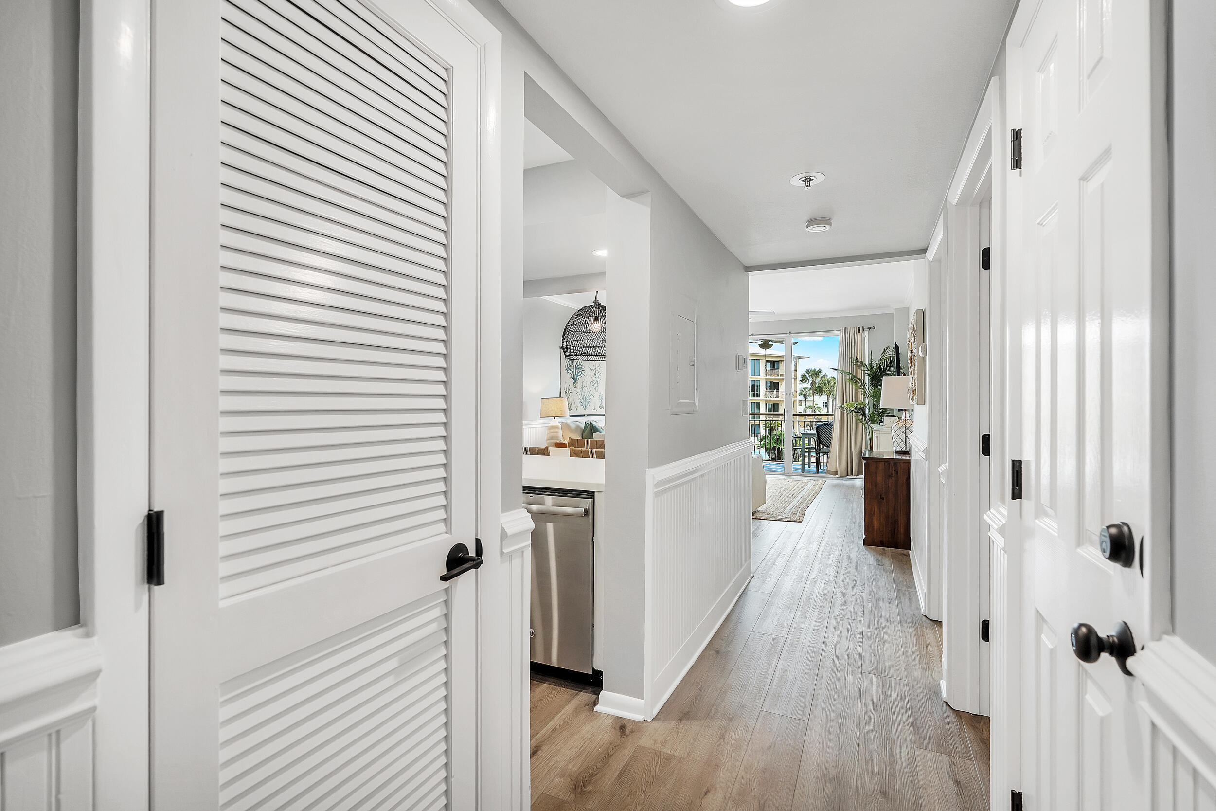 10254 East Co Highway, Unit 233 Inlet Beach, FL 32461 - Photo 2 of 46 a view of a hallway with wooden floor and a bathroom