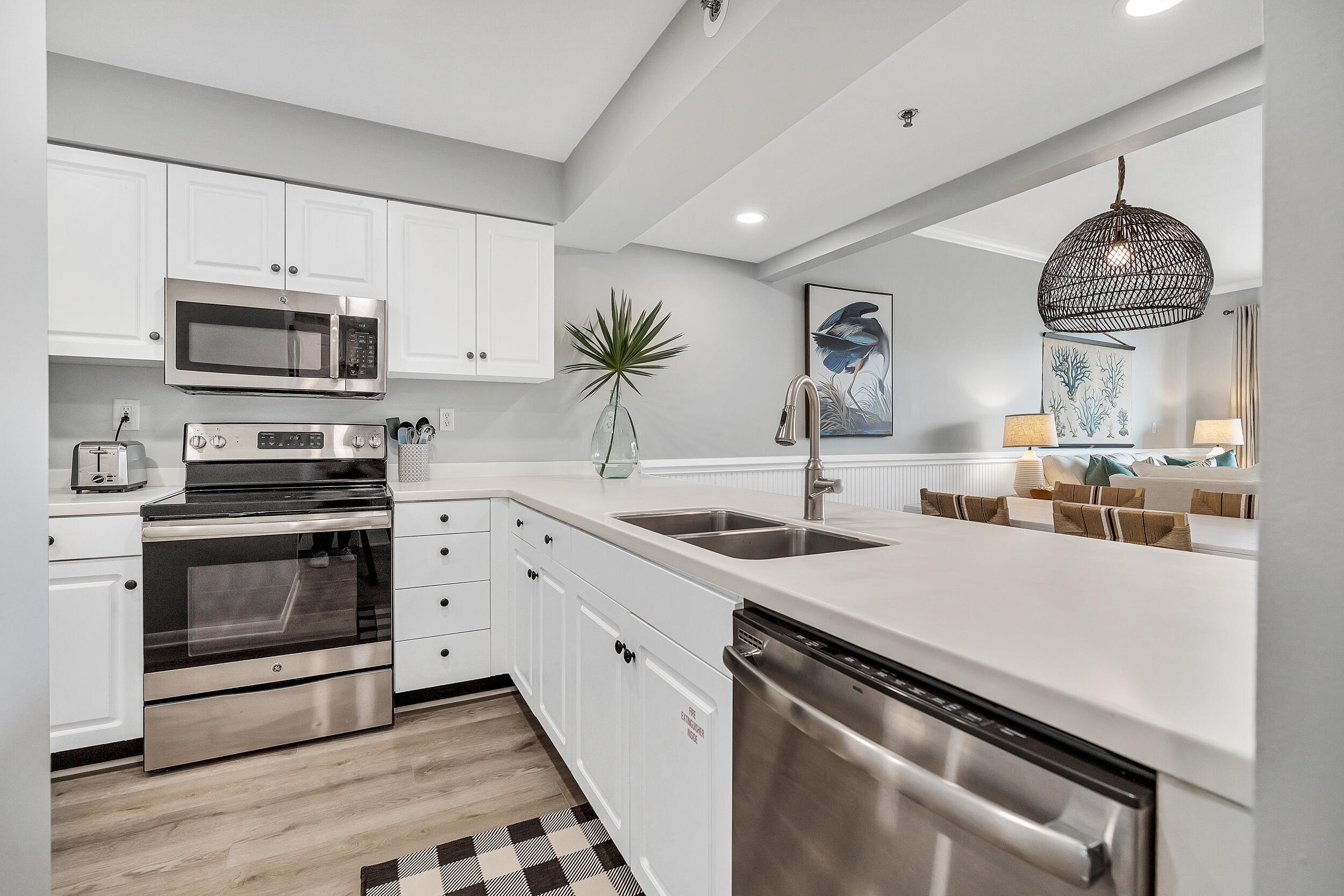 10254 East Co Highway, Unit 233 Inlet Beach, FL 32461 - Photo 3 of 46 a kitchen with stainless steel appliances a stove microwave and sink