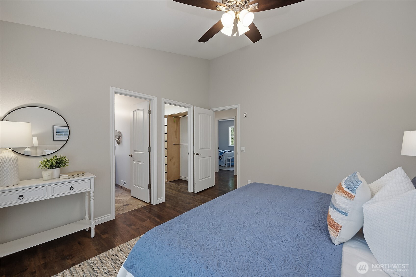 23707 Meridian Place West Bothell, WA 98021 - Photo 18 of 40 a bedroom with a bed and a chandelier