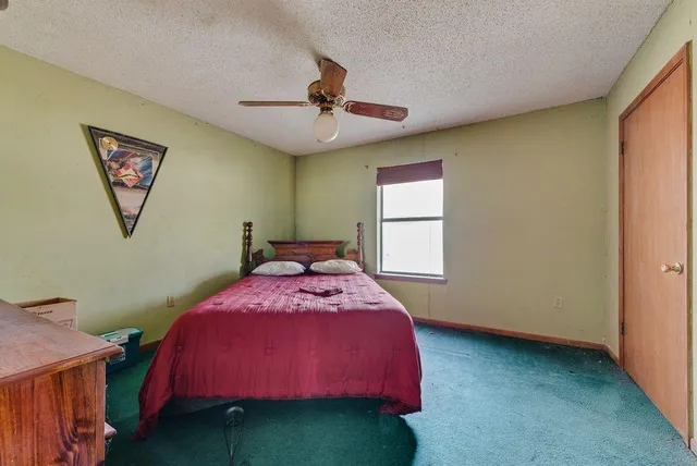 a bathroom with a sink toilet and mirror