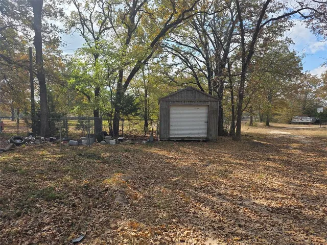 a view of a forest with trees