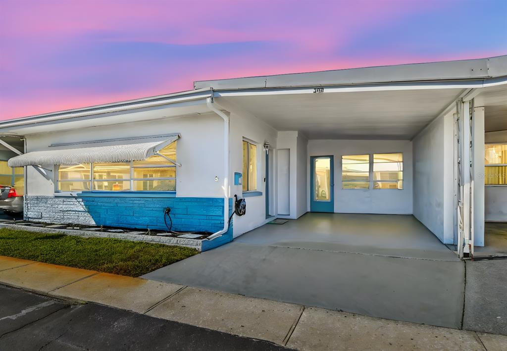 a view of front door of a house with porch