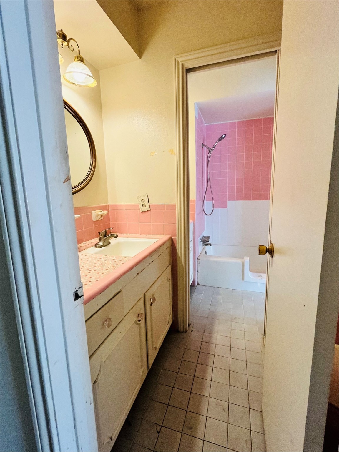 9442 Neuens Road, Unit 9442 Houston, TX 77080 - Photo 16 of 24 a bathroom with a double vanity sink and a mirror