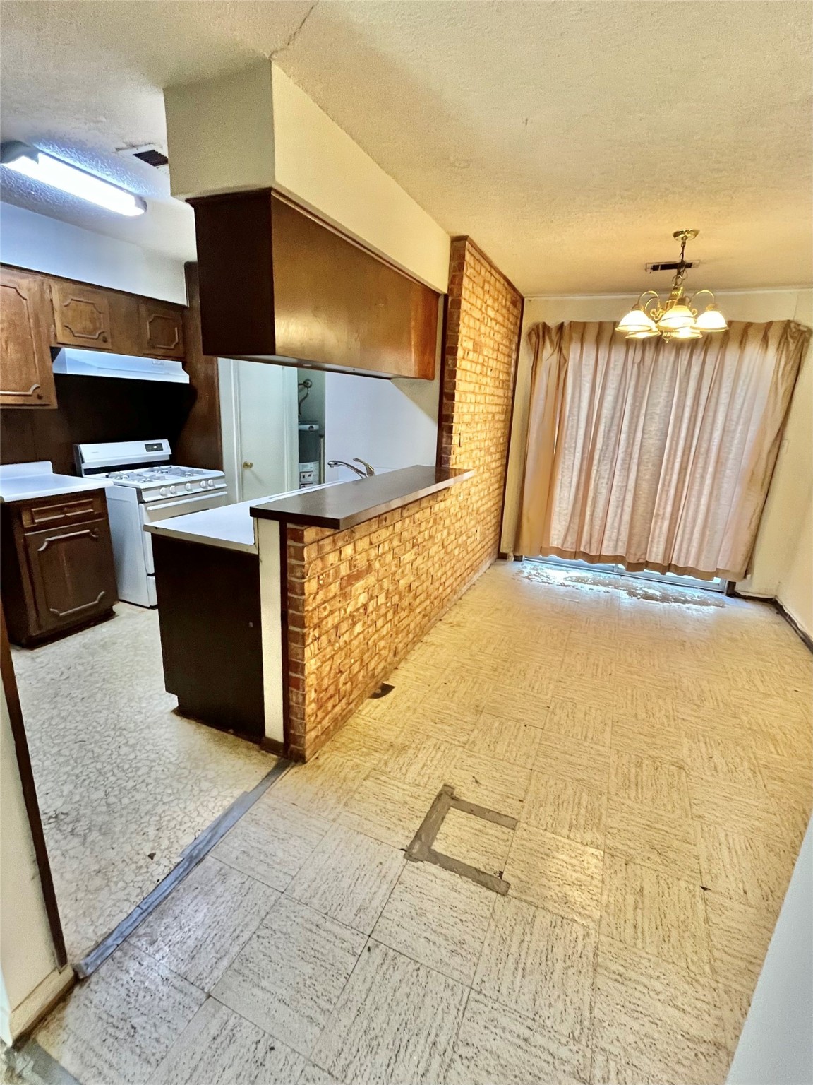 9442 Neuens Road, Unit 9442 Houston, TX 77080 - Photo 7 of 24 a view of kitchen with stainless steel appliances wooden floor