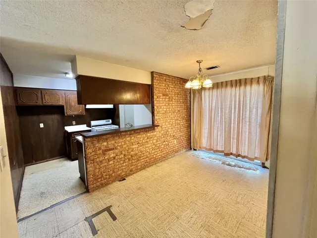 a view of a elevator with wooden floor