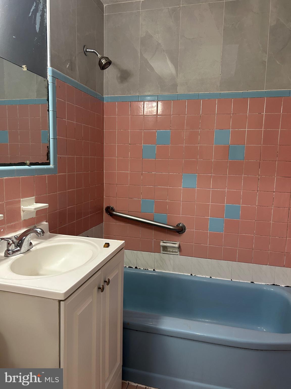 2746 Elbridge Street Philadelphia, PA 19149 - Photo 14 of 21 a bathroom with a sink and a mirror