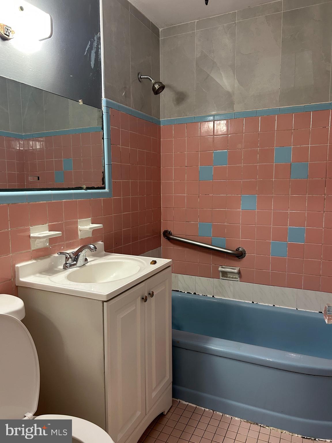 2746 Elbridge Street Philadelphia, PA 19149 - Photo 15 of 21 a bathroom with a sink and a mirror