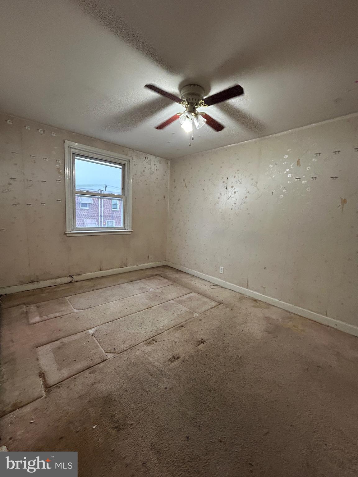 2746 Elbridge Street Philadelphia, PA 19149 - Photo 18 of 21 an empty room with windows and fan