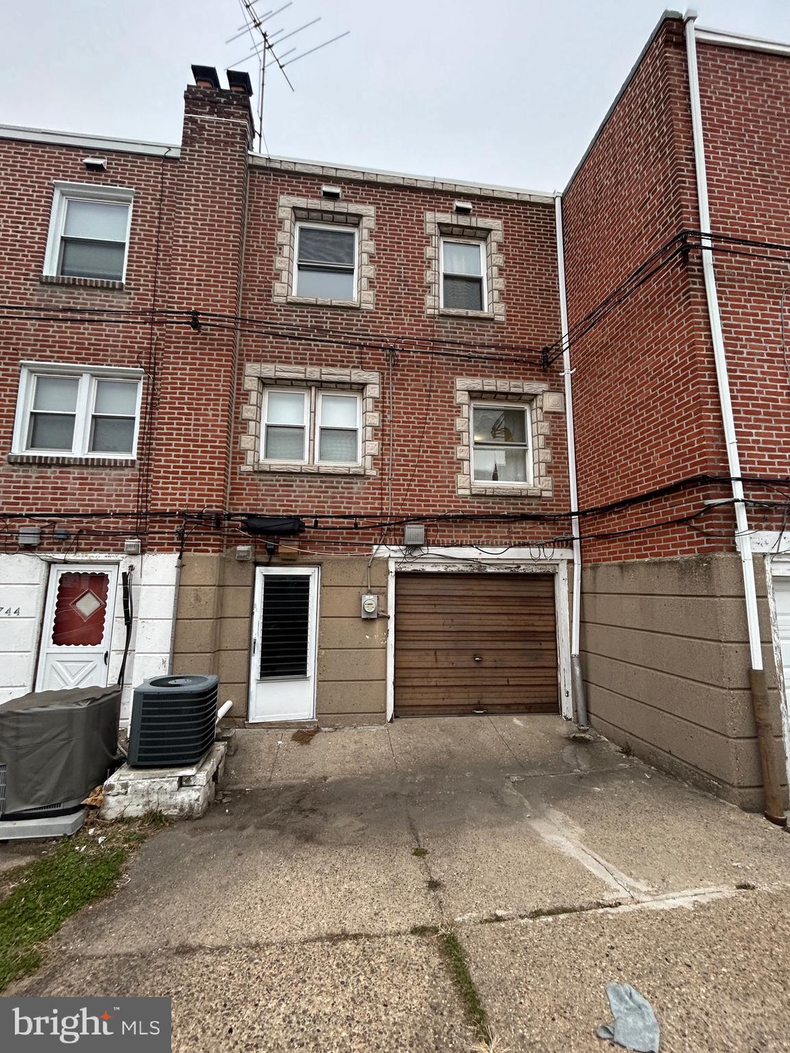 2746 Elbridge Street Philadelphia, PA 19149 - Photo 20 of 21 a view of a brick house with many windows