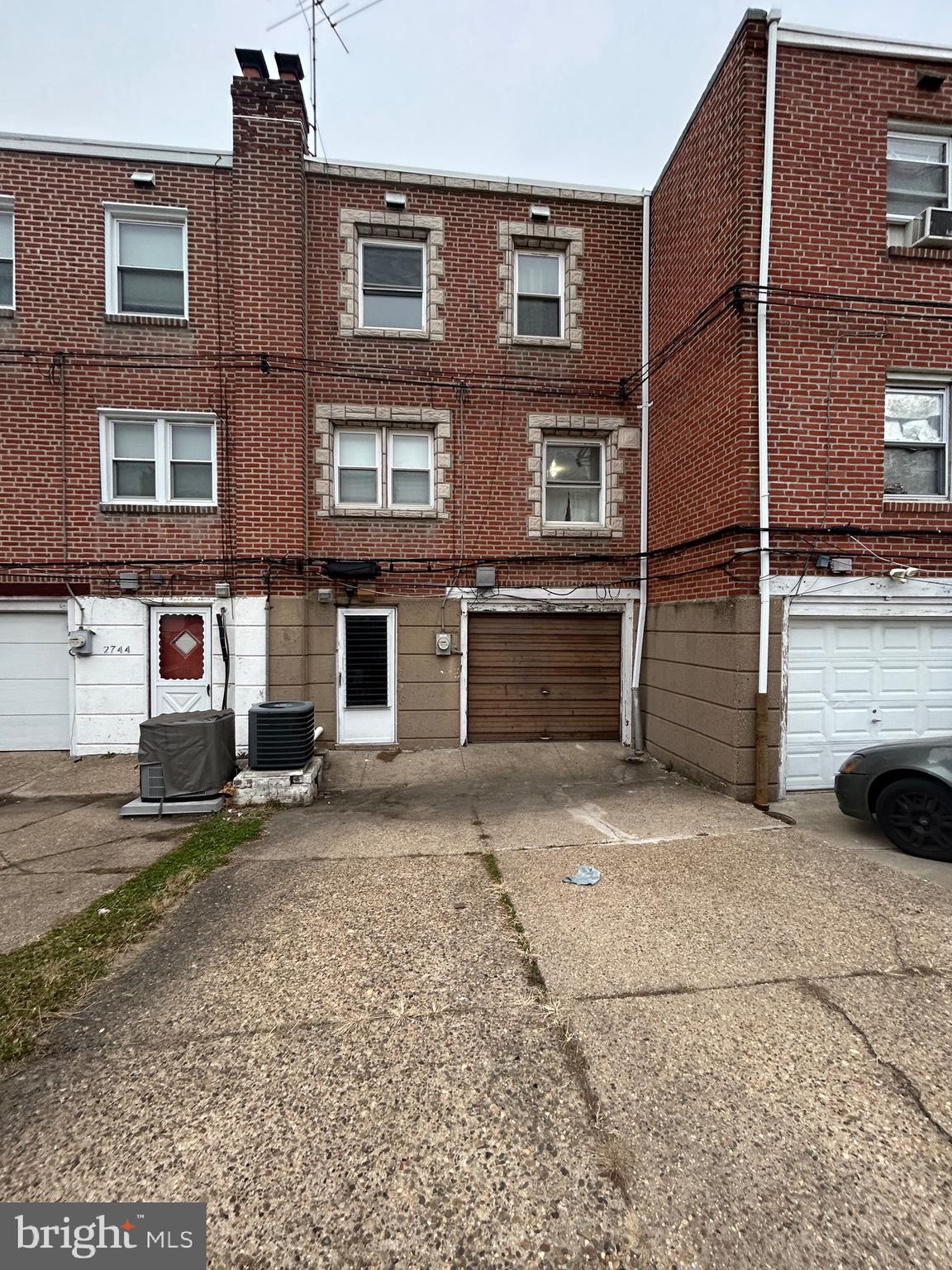 2746 Elbridge Street Philadelphia, PA 19149 - Photo 21 of 21 a view of a house with a yard and parking space