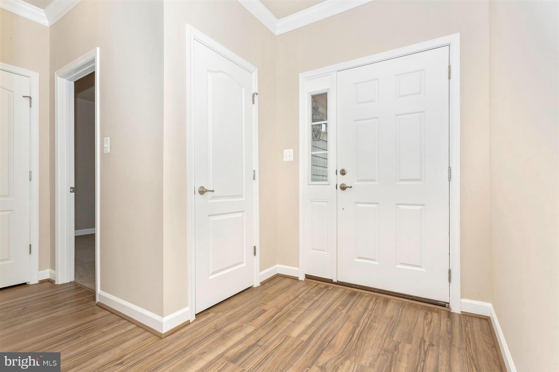 5305 Renn Road Frederick, MD 21703 - Photo 2 of 13 an empty room with wooden floor and closet