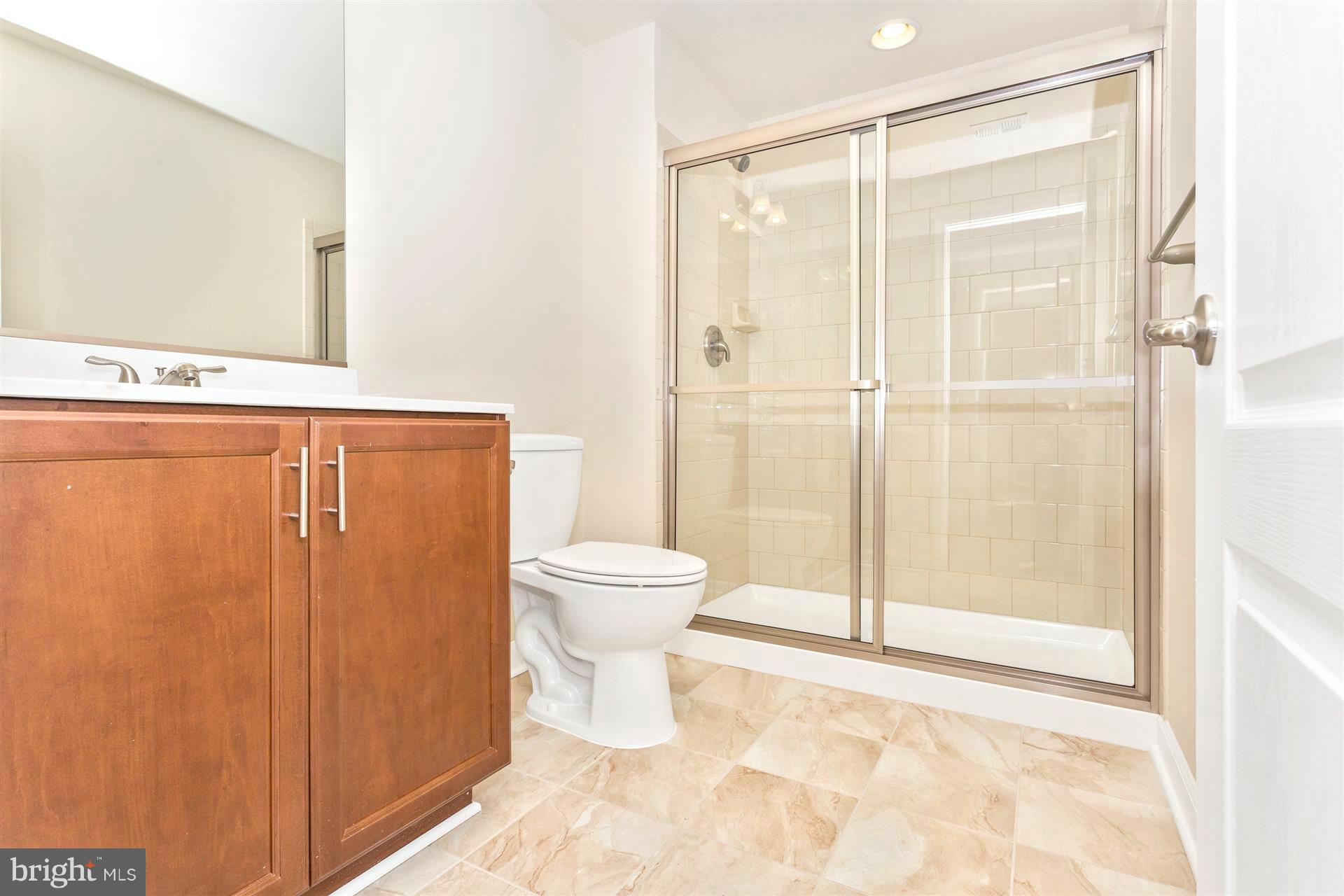 5305 Renn Road Frederick, MD 21703 - Photo 8 of 13 a bathroom with a shower and a toilet