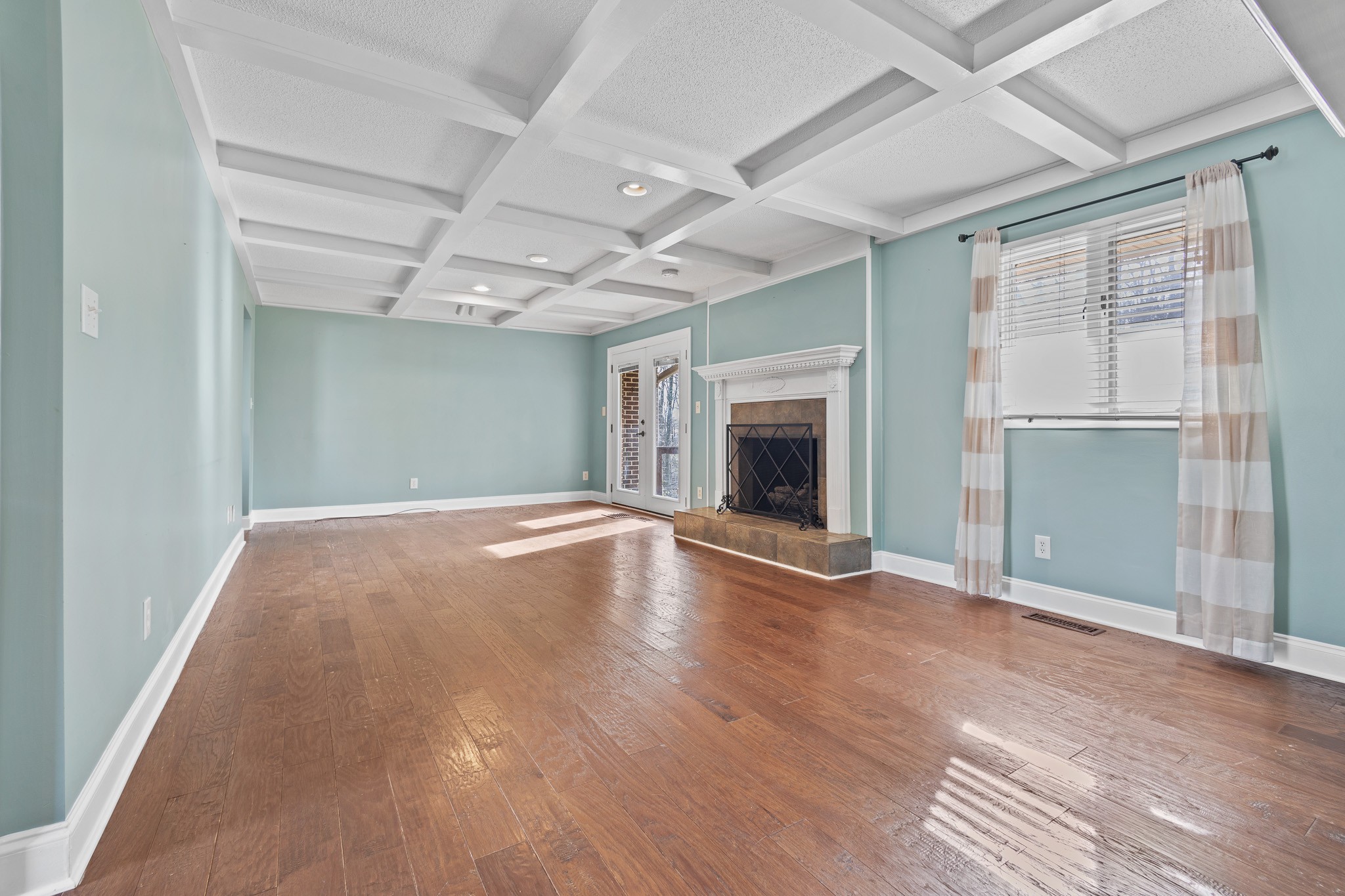 60 Sharp Circle Winchester, TN 37398 - Photo 4 of 51 an empty room with wooden floor fireplace and windows