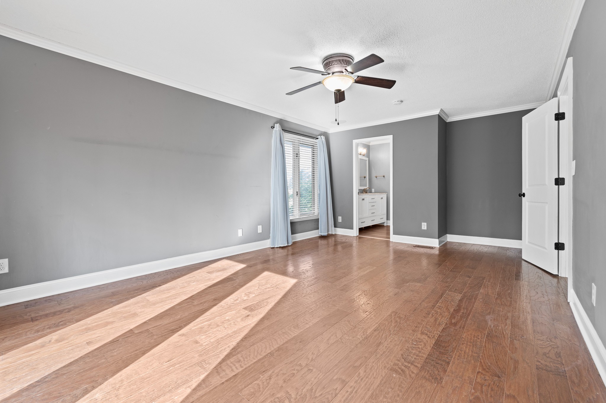 60 Sharp Circle Winchester, TN 37398 - Photo 8 of 51 a view of an empty room with chandelier fan and wooden floor
