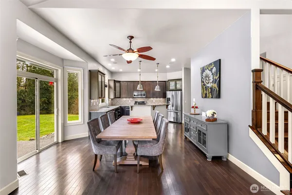 a view of a dining room with furniture window and wooden floor