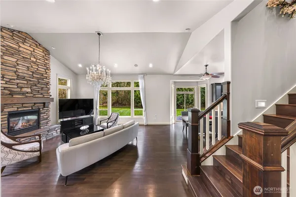 a living room with furniture fireplace and flat screen tv