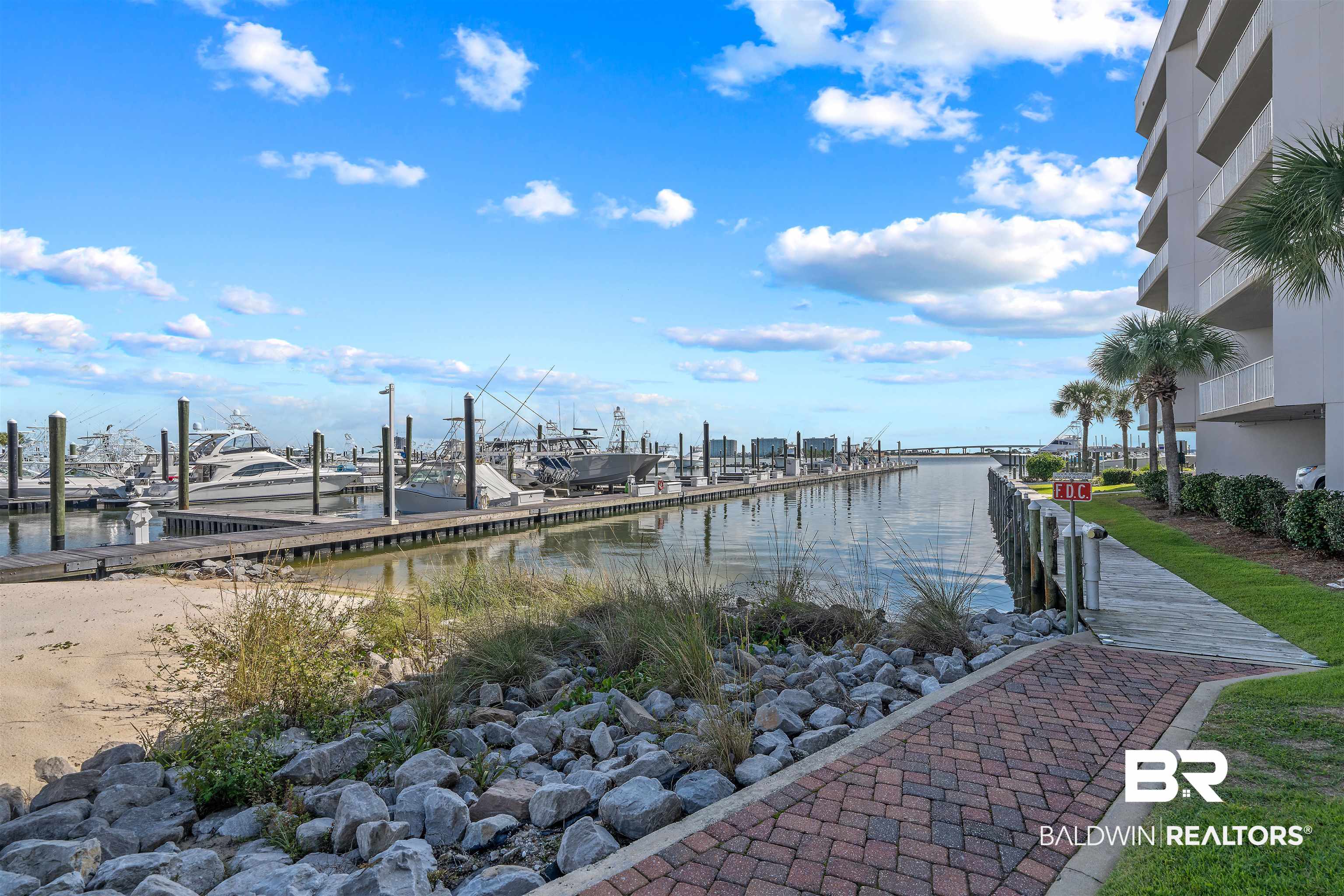 27800 Canal Road, Unit 113 Orange Beach, AL 36561 - Photo 28 of 35 Dock featuring a water view and view of marina