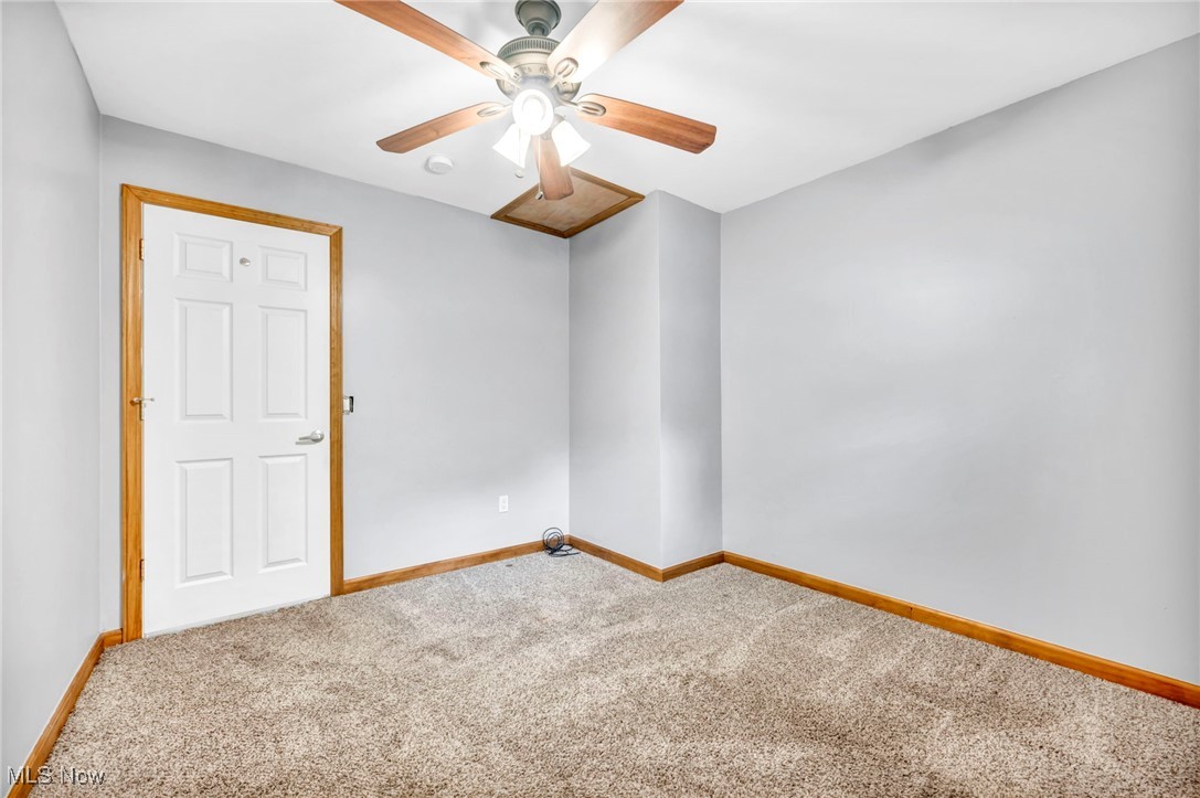 6081 Laskey Road Rome, OH 44085 - Photo 16 of 25 Carpeted empty room featuring ceiling fan