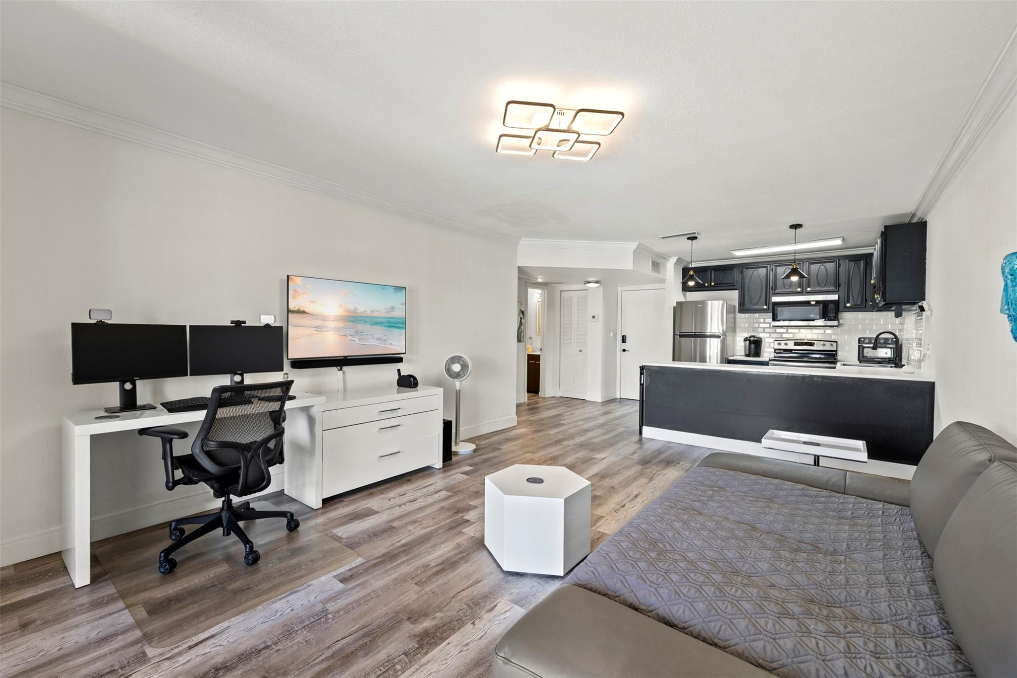 101 East McNab Road, Unit 219 Pompano Beach, FL 33060 - Photo 13 of 26 a living room with furniture and a workspace