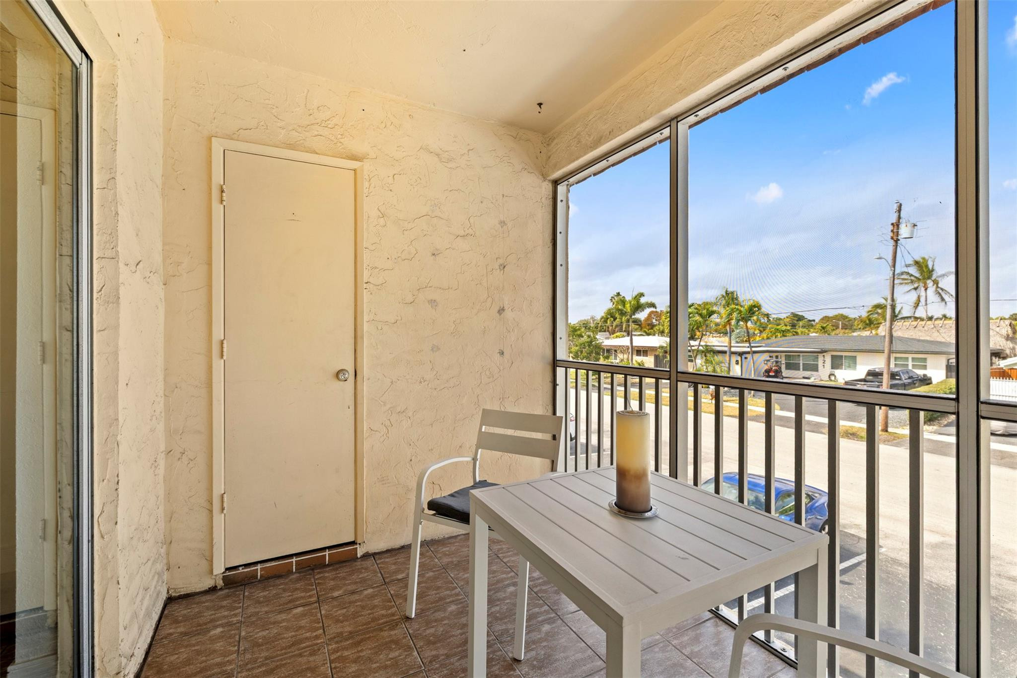 101 East McNab Road, Unit 219 Pompano Beach, FL 33060 - Photo 15 of 26 a view of a city from a dining room with furniture window and wooden floor