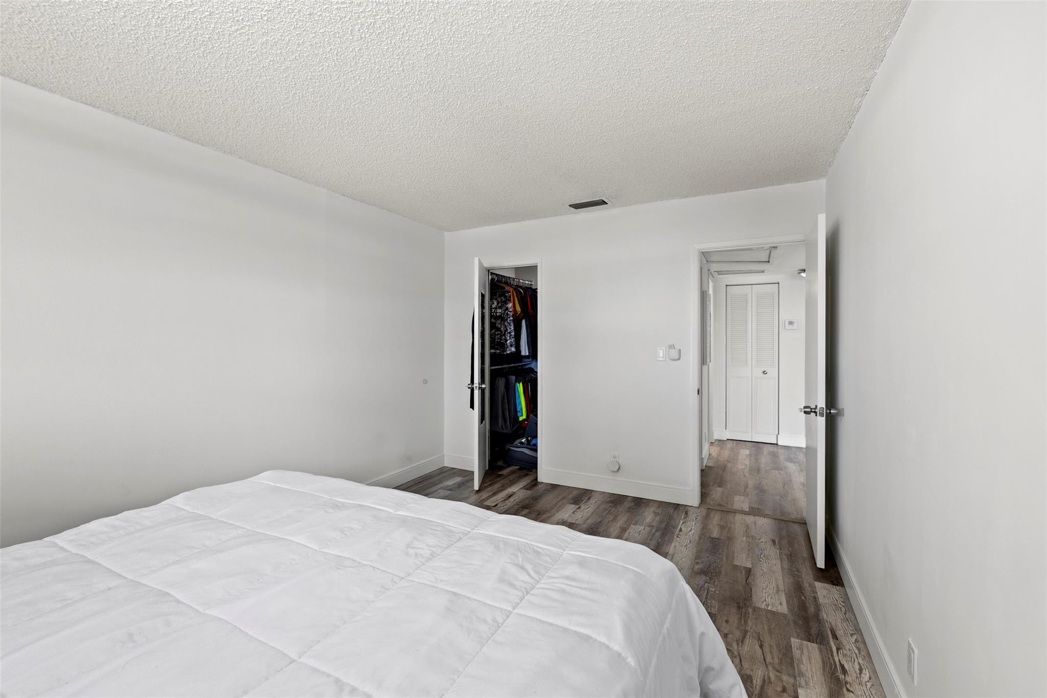 101 East McNab Road, Unit 219 Pompano Beach, FL 33060 - Photo 17 of 26 a bedroom with a bed and a window