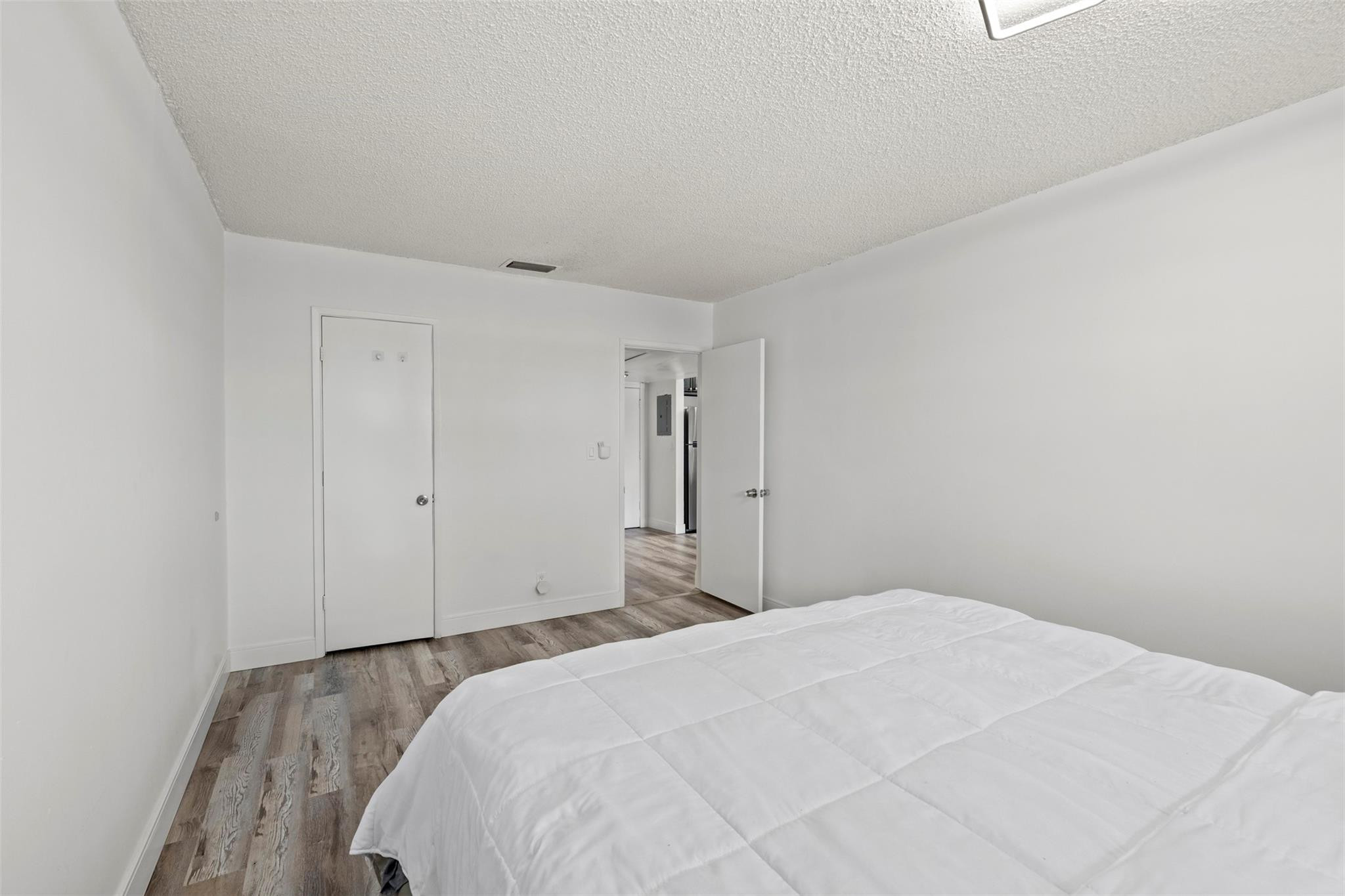 101 East McNab Road, Unit 219 Pompano Beach, FL 33060 - Photo 18 of 26 a bedroom with a bed and a dresser