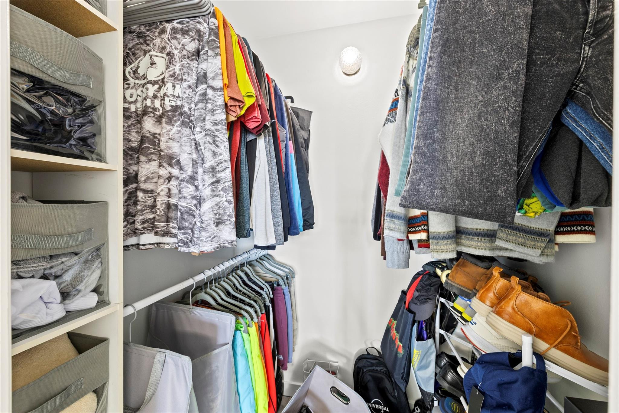 101 East McNab Road, Unit 219 Pompano Beach, FL 33060 - Photo 19 of 26 a view of walk in closet with clothes and shoes