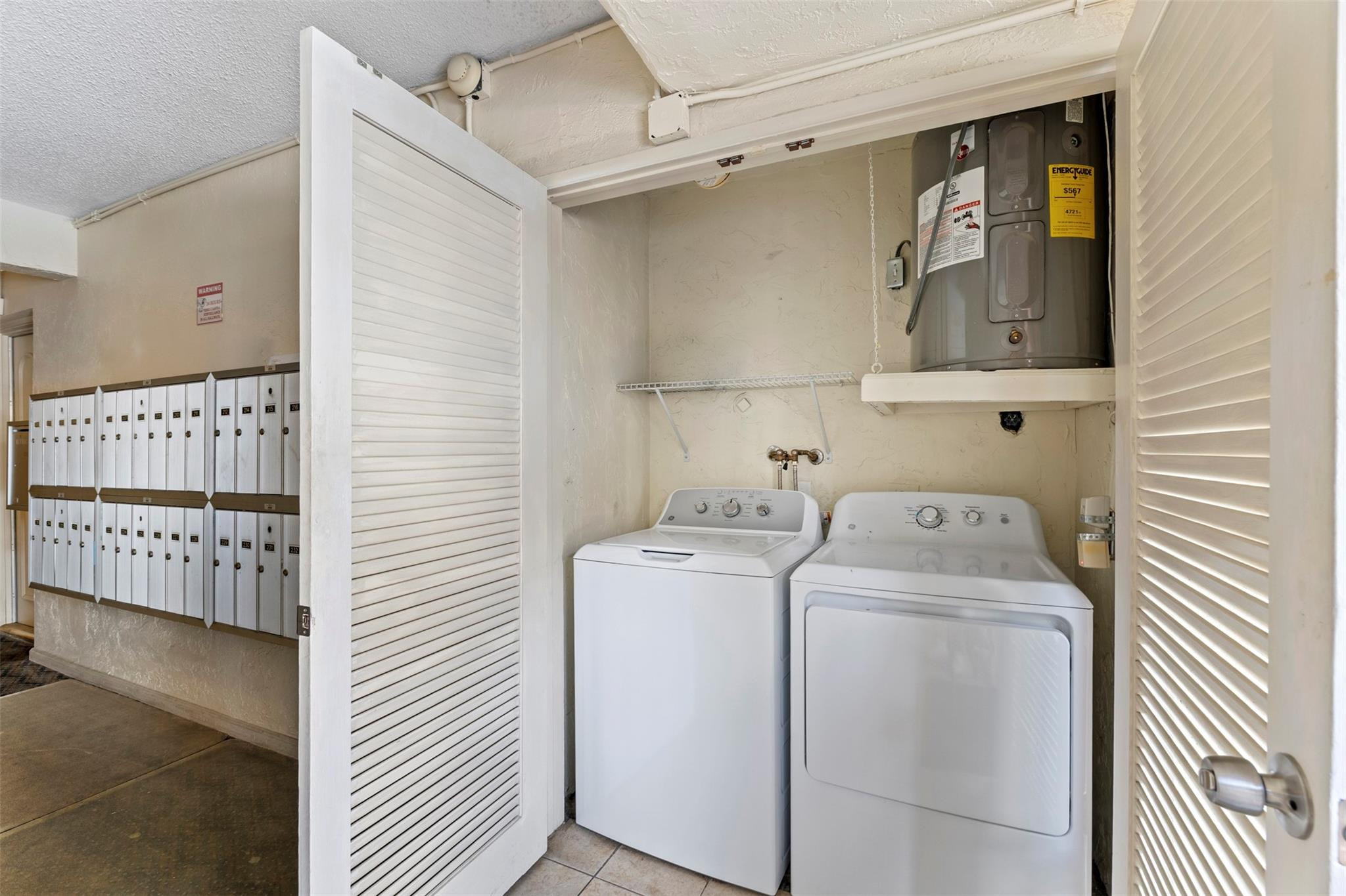 101 East McNab Road, Unit 219 Pompano Beach, FL 33060 - Photo 21 of 26 a utility room with dryer and washer