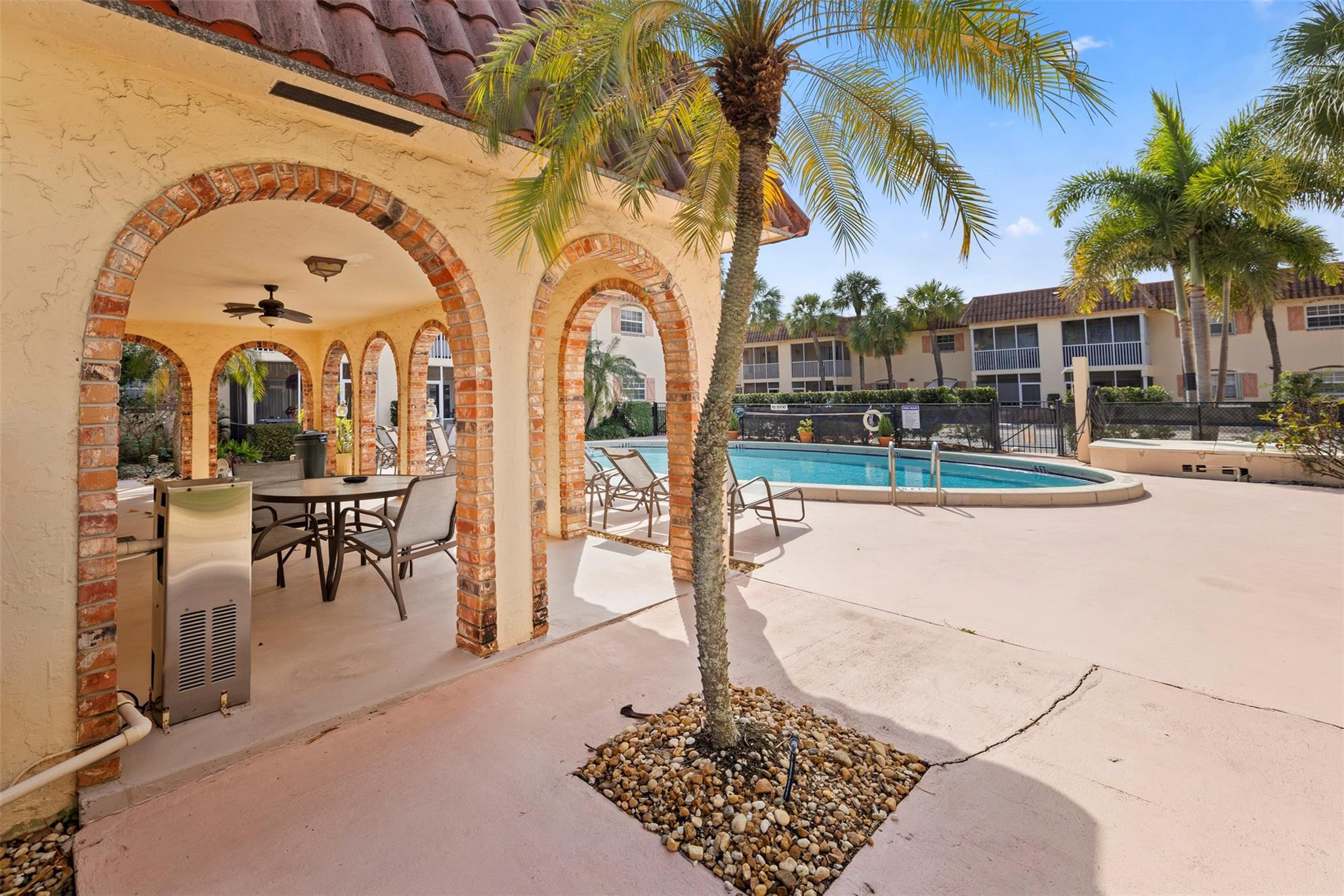 101 East McNab Road, Unit 219 Pompano Beach, FL 33060 - Photo 23 of 26 a view of swimming pool with outdoor seating