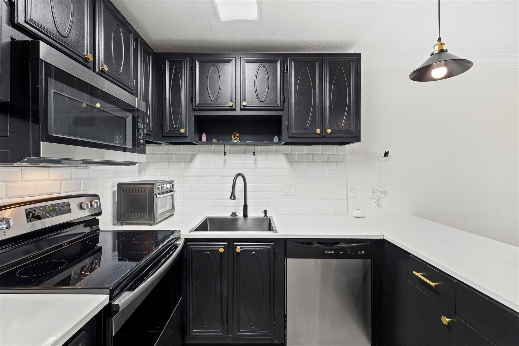 101 East McNab Road, Unit 219 Pompano Beach, FL 33060 - Photo 6 of 26 a kitchen with a sink and steel appliances